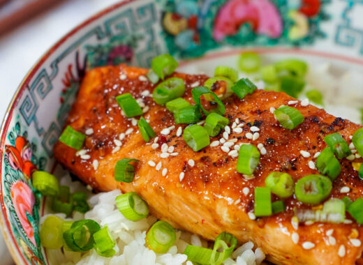 Hot Honey Sriracha Asian Marinade for Salmon on a salmon rice bowl.