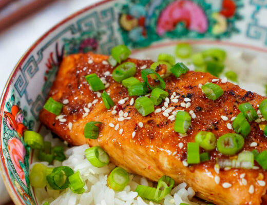 Hot Honey Sriracha Asian Marinade for Salmon on a salmon rice bowl.