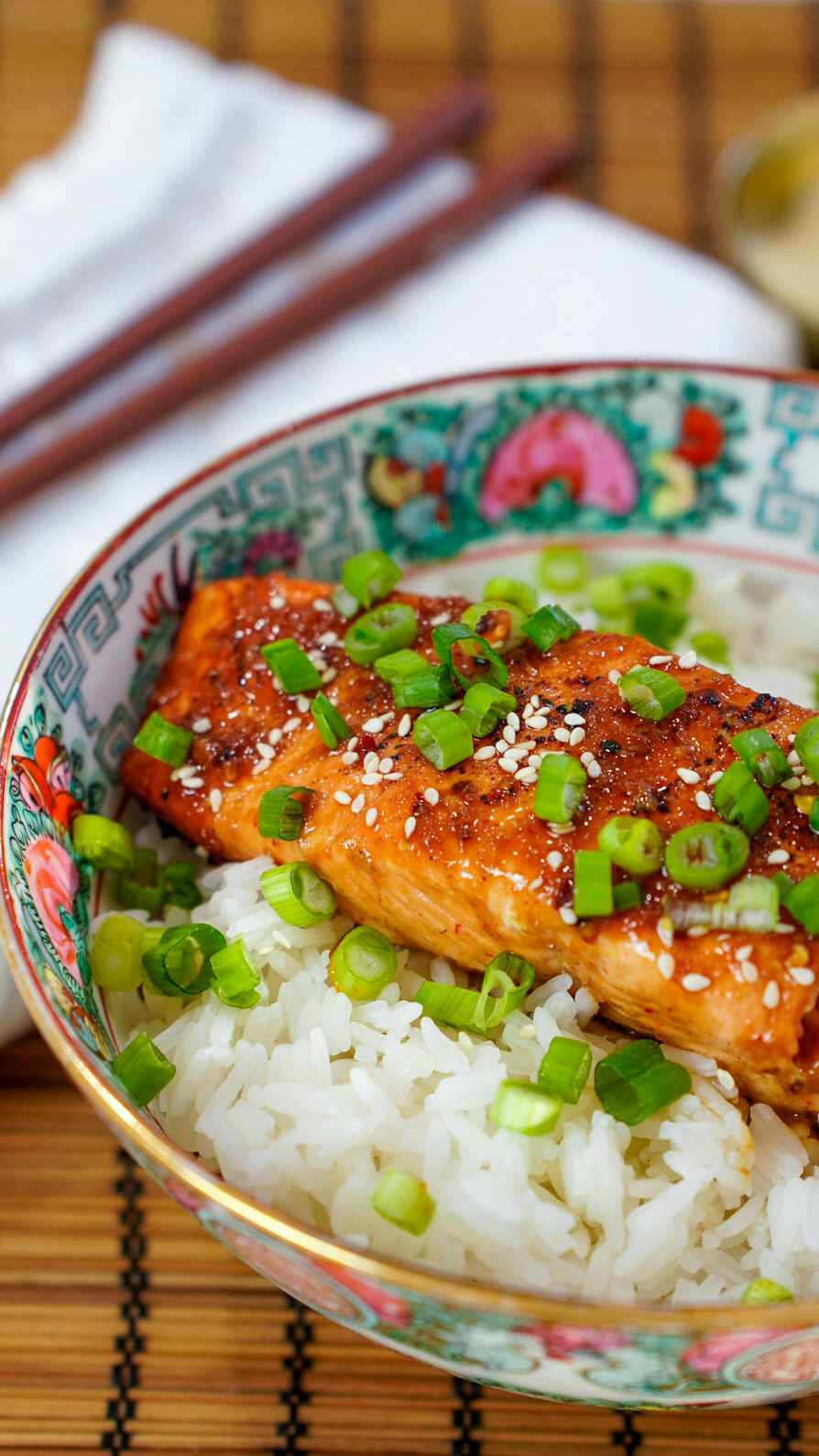 Hot Honey Sriracha Asian Marinade for Salmon on a salmon rice bowl.