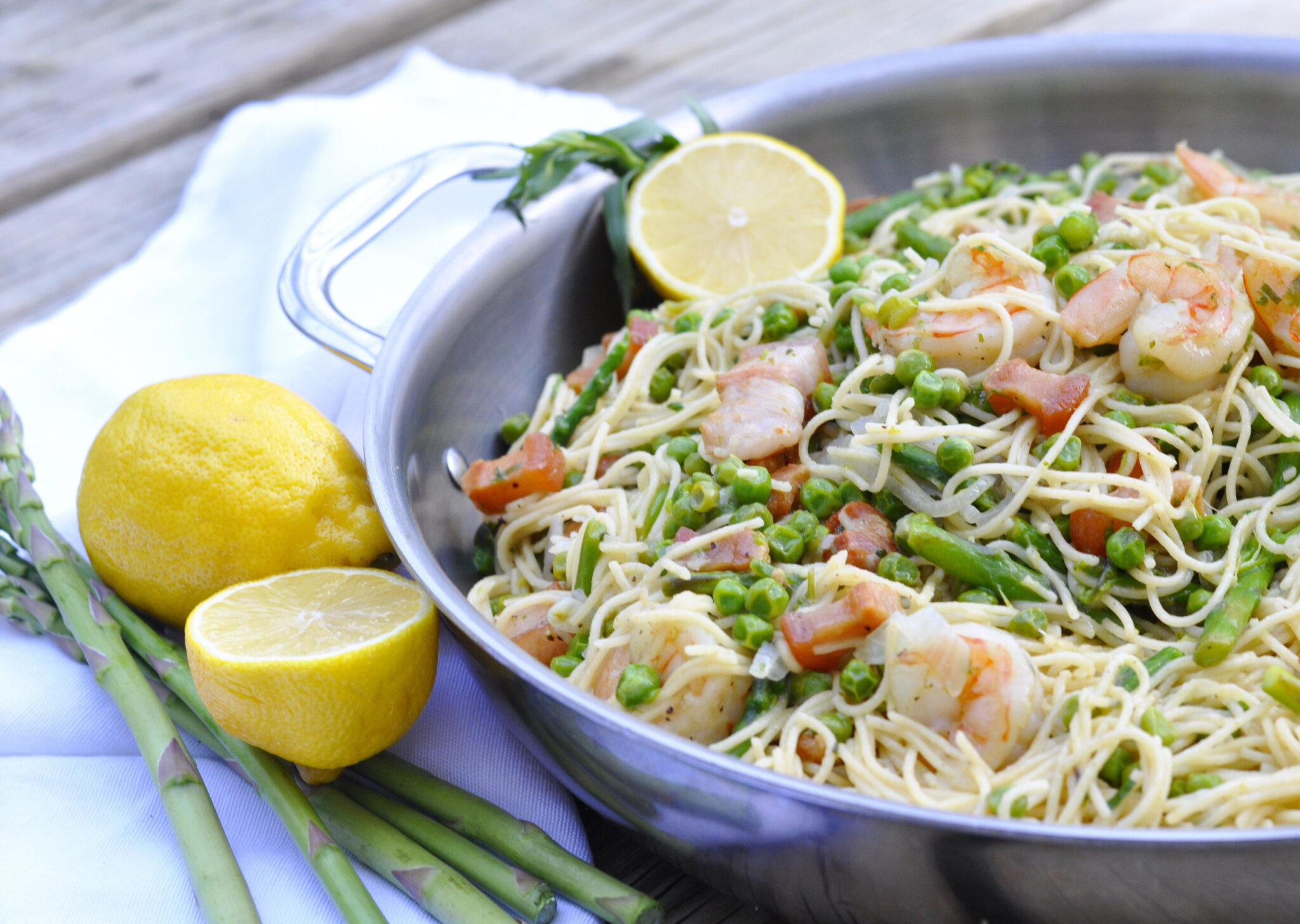 Asparagus and English Pea Pasta with Pancetta & Shrimp Couple in the