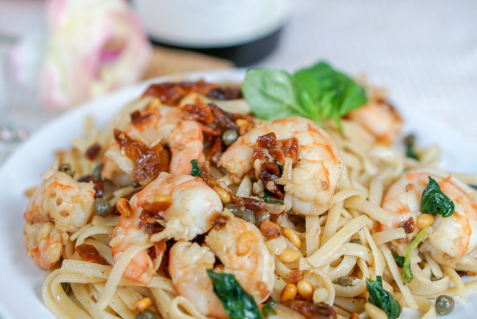 Sun dried tomato pasta with shrimp, capers, basil, and toasted pine