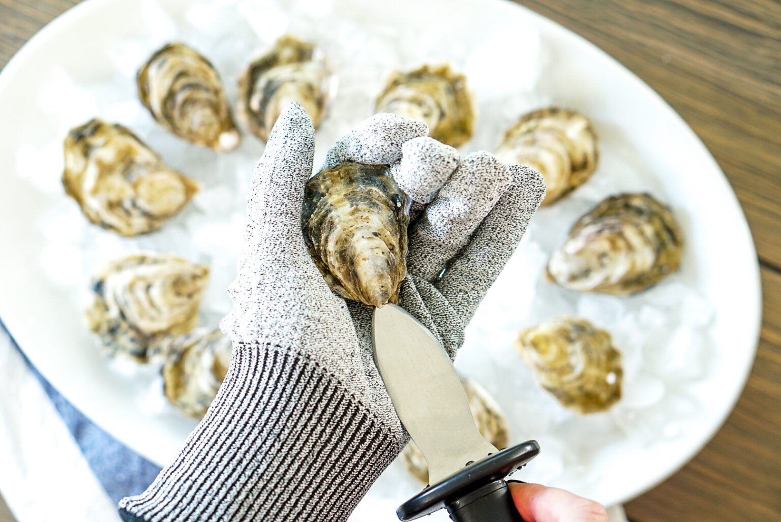 How to Store, Shuck, and Serve Oysters Couple in the Kitchen
