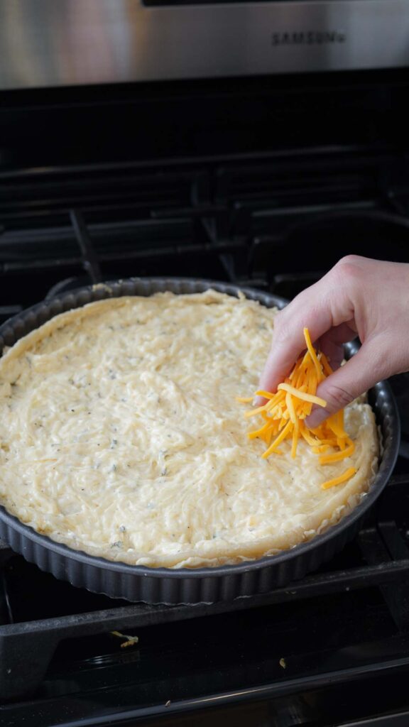 Putting cheese on a tart crust