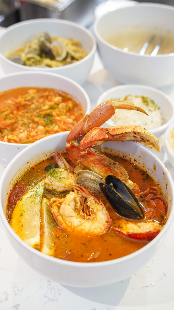 Seafood in a bowl of broth at The oyster bar in lake tahoe.