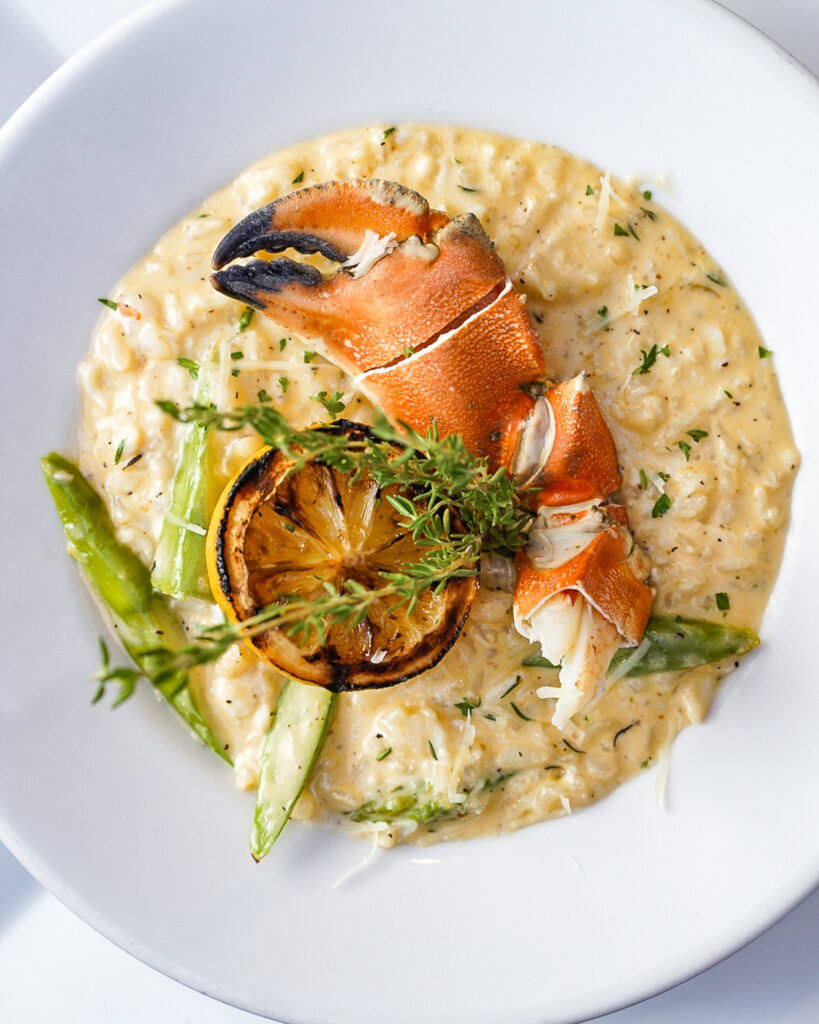 Plate of Seafood risotto with a crab claw at the best restaurant in Lake Tahoe.