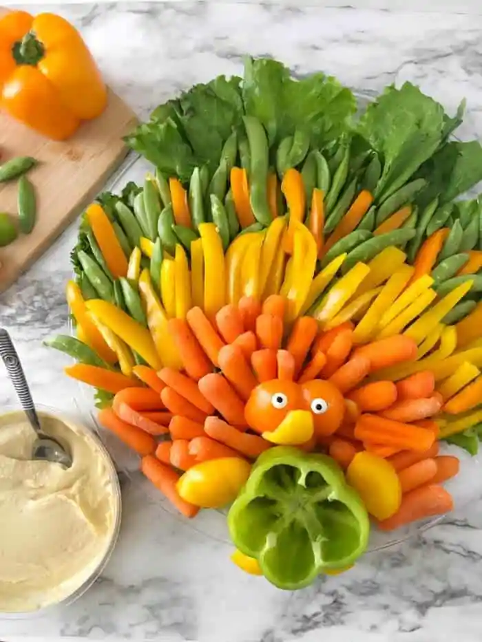 Veggie tray shaped like a turkey.