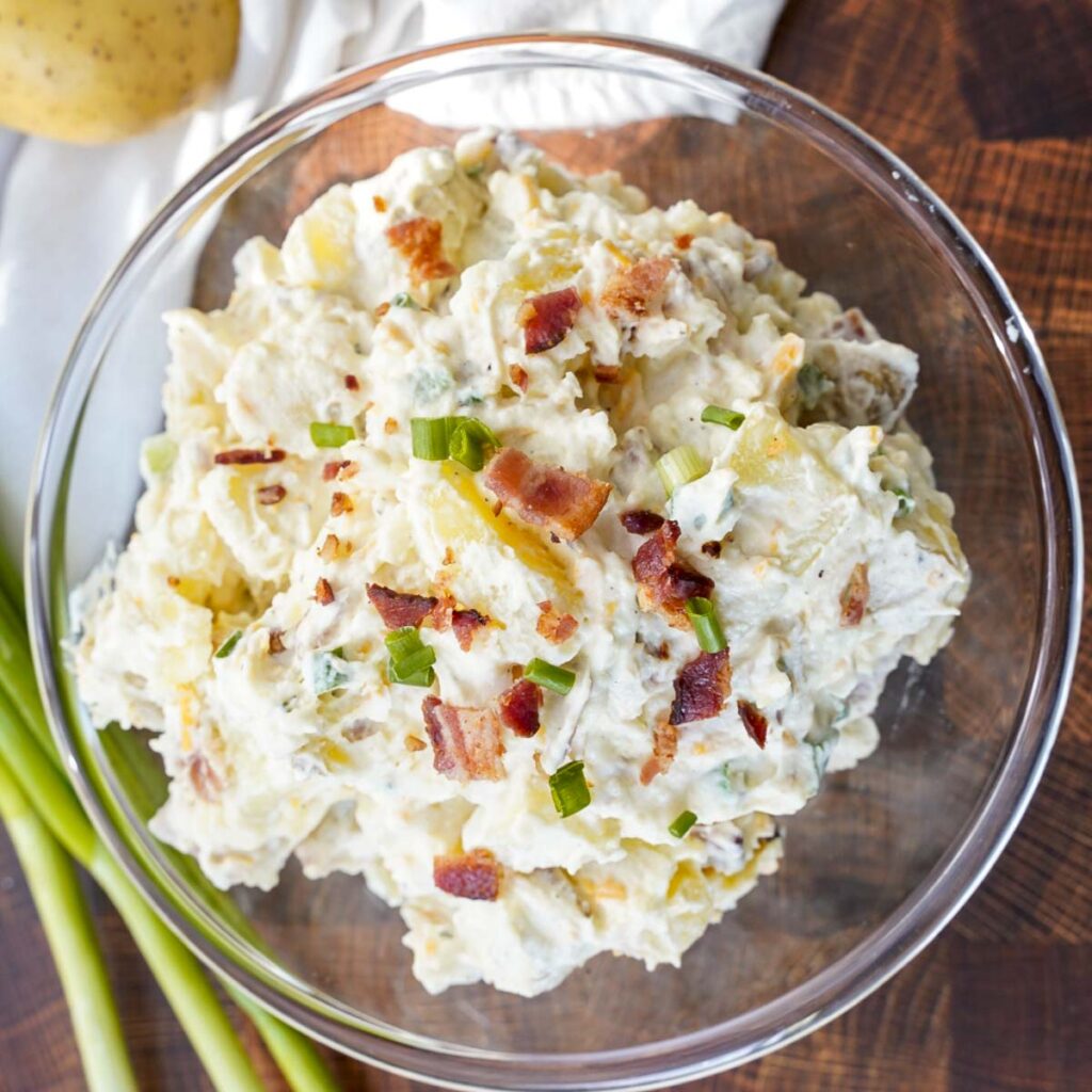 Loaded baked potato salad as a side dish for fried fish.