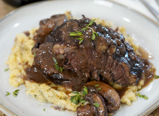 Braised beef cheeks from an instant pot pressure cooker on mashed potatoes.