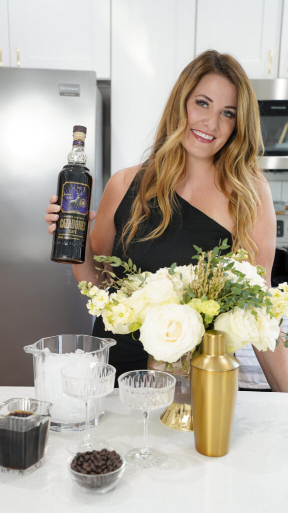 Woman with Tequila Espresso Martini Recipe ingredients.