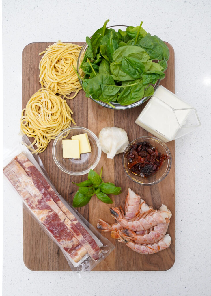 Ingredients for Tuscan Seafood Pasta Recipe with White Sauce.