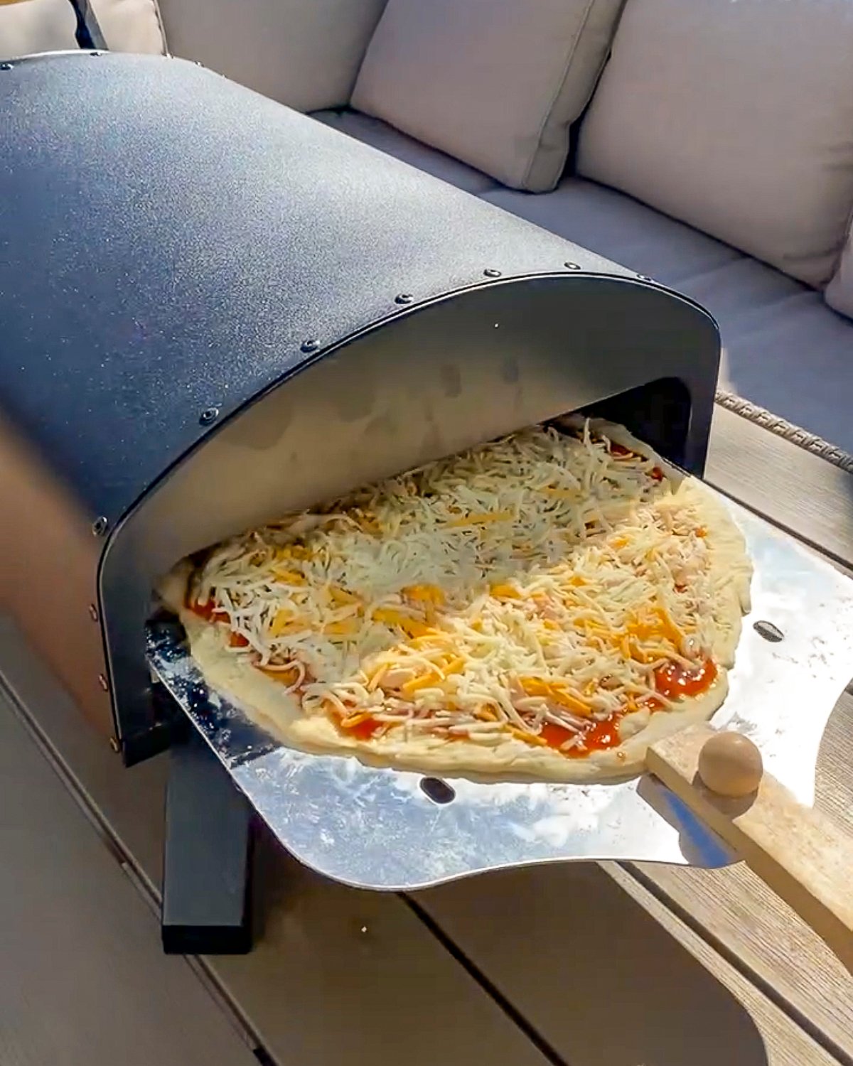 Bertello Pizza Oven vs Ooni Which is Right for You? Couple in the