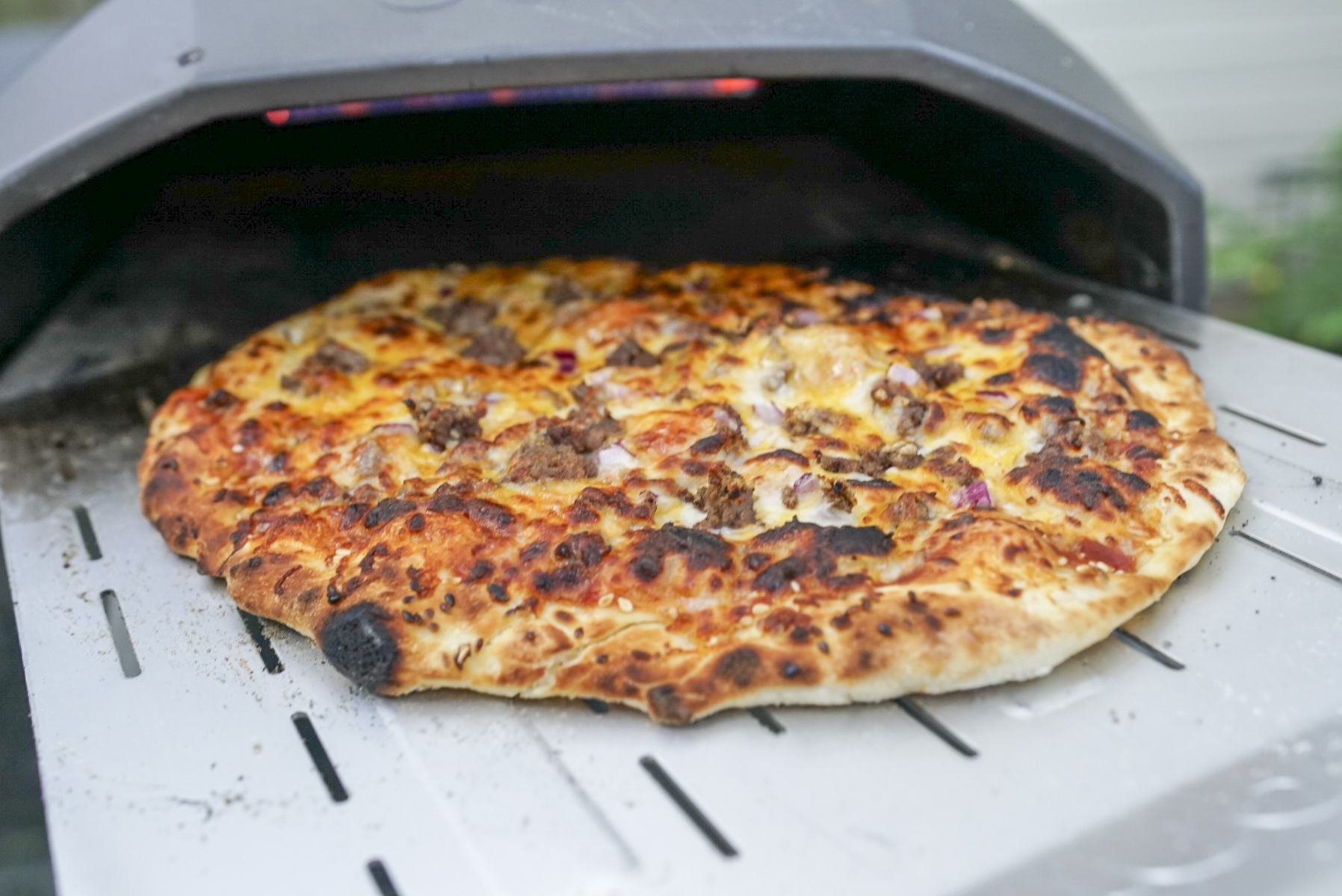 Bertello Pizza Oven vs Ooni Which is Right for You? Couple in the