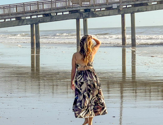 Woman walking on the shore of Myrtle Beach.
