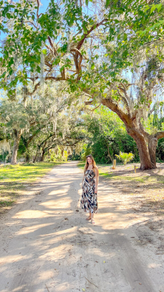 Karen smiling under a tree in Myrtle Beach