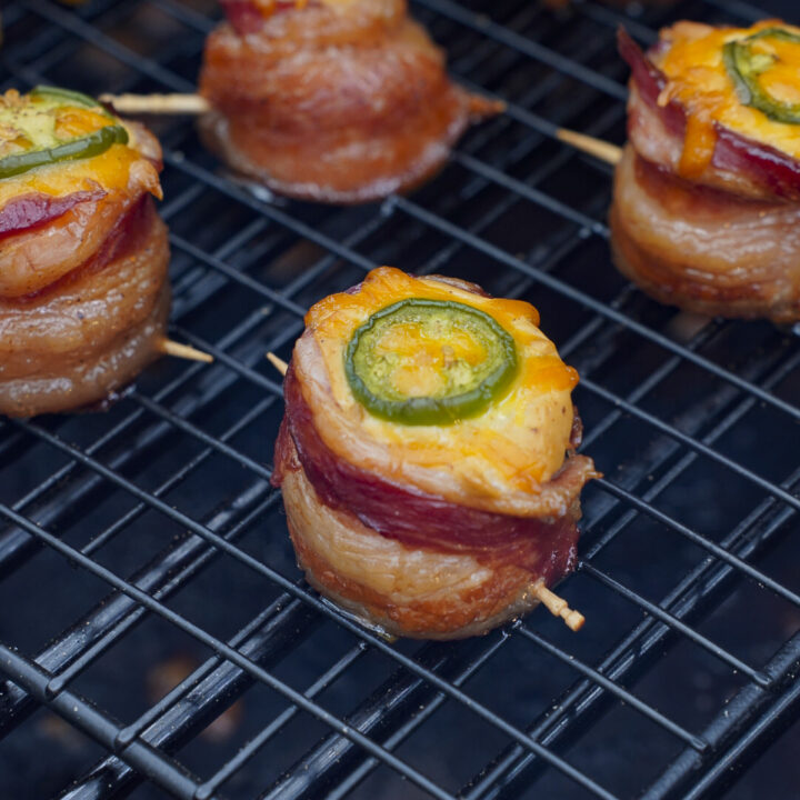 Bacon wrapped pig shots on the grill.