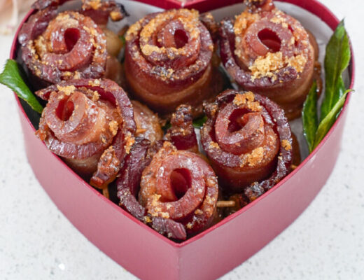 Candied bacon roses in a heart shaped box.