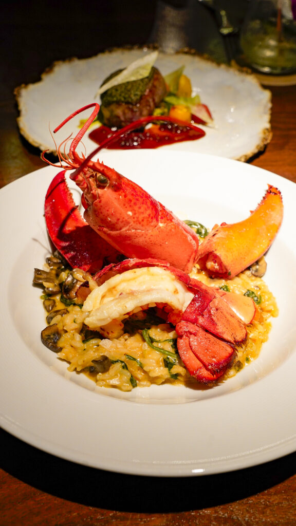 Lobster on top of risotto at Hoku's Restaurant, a romantic thing to do in Oahu, Hawaii.