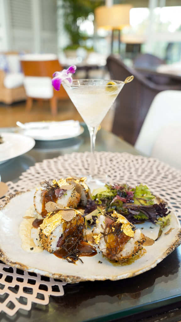 Romantic restaurant in Oahu, Hawaii with masubi and a martini