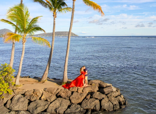 Couple hugging on the shore, romantic things to do in Oahu, Hawaii.
