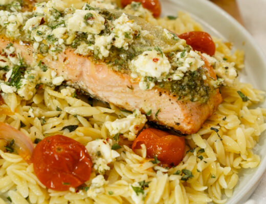 Baked Mediterranean Salmon Recipe with Marinated Feta on a plate.