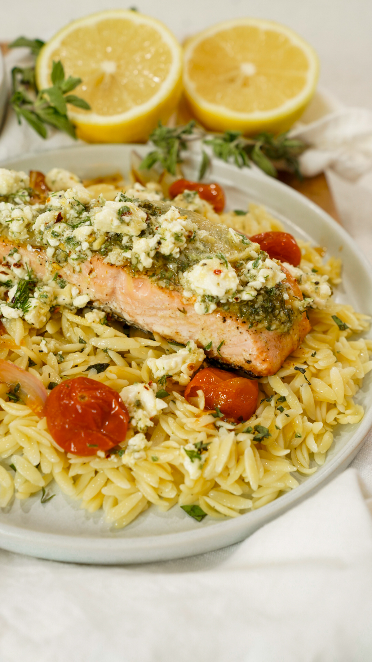 Baked Mediterranean Salmon Recipe with Marinated Feta on a plate.