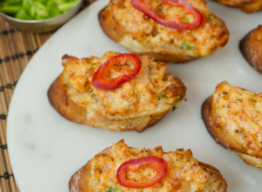 Vietnamese Shrimp Toast - Banh Mi Chien Tom on a platter with a pepper on top.