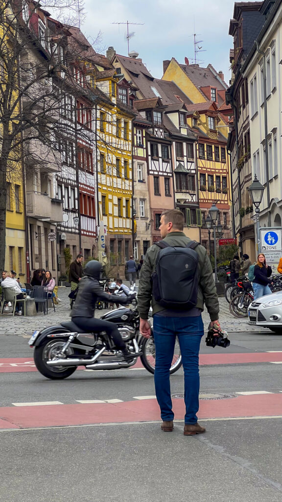 Man holding a camera in Nuremberg, Germany.