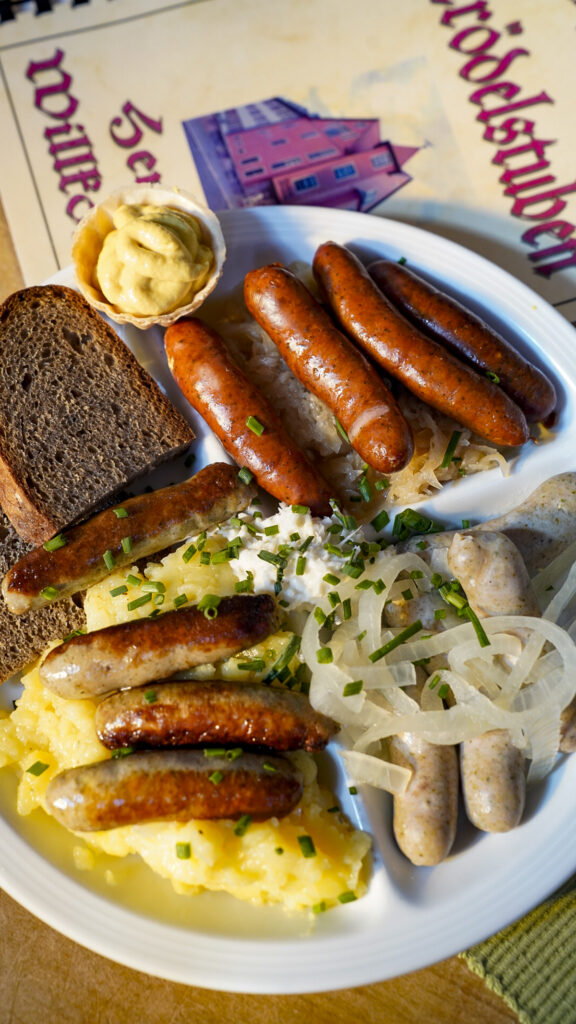 Plate of three different Nuremberg sausages one of the best restaurants in Nuremberg, Germany.