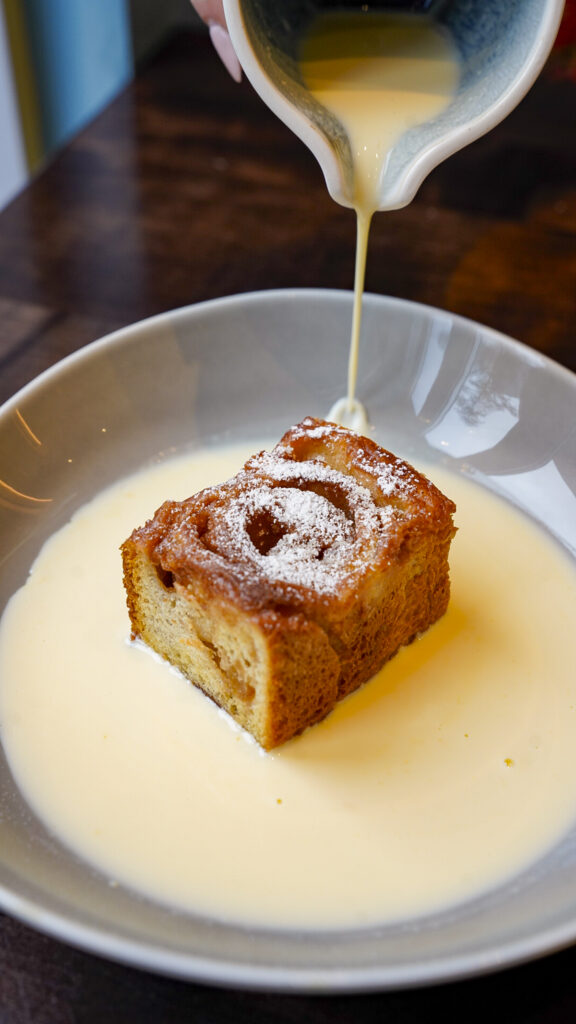 Cinnamon roll with sauce at one of the best restaurants near Nuremberg, Germany.