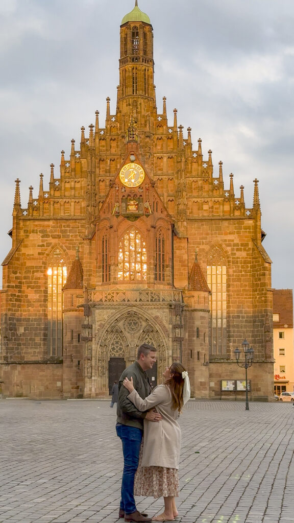 Couple hugging in at the old town square of Nuremberg, Germany.