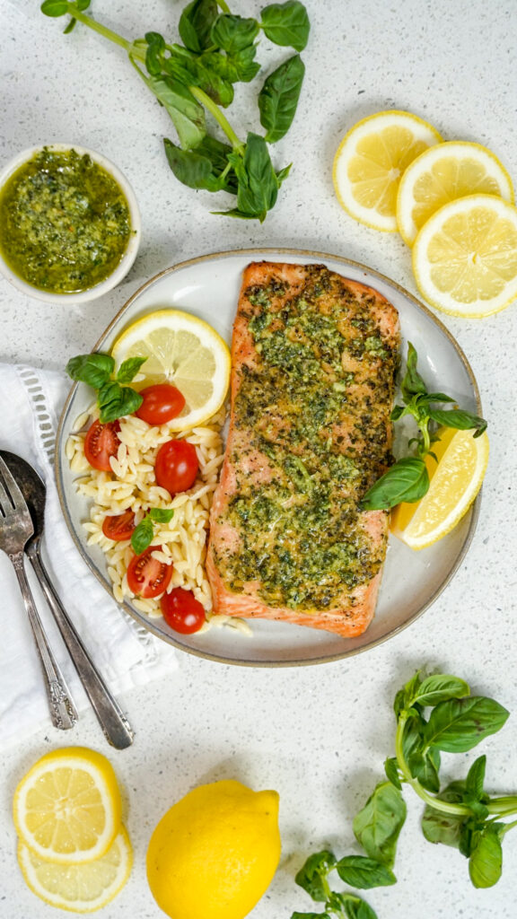 A plate topped with a grilled pesto salmon recipe.