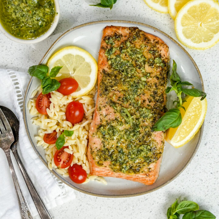 A plate topped with a grilled pesto salmon recipe.