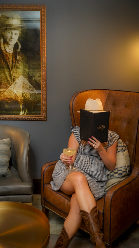 Woman sitting in a chair at Paramount Recreation Club speakeasy in Amarillo, Texas.