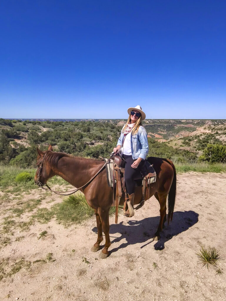 Woman horseback riding at Palo Duro Canyon.