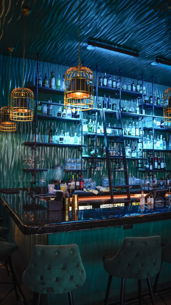 Illuminated bar at Savor in Amarillo, Texas.