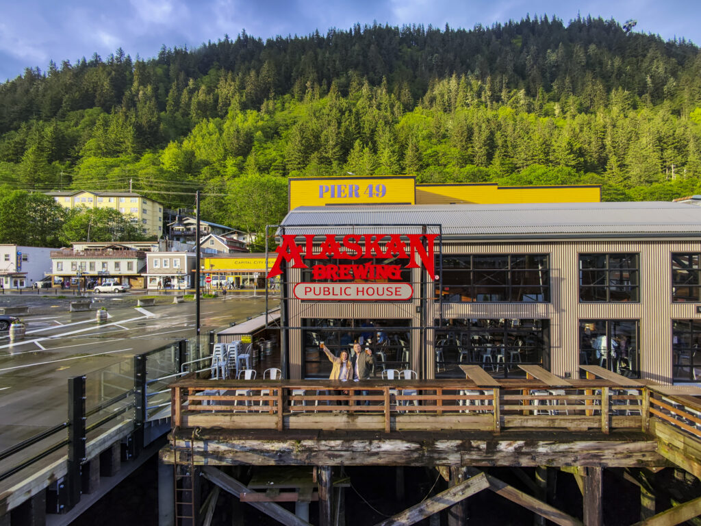 Couple standing at Alaska Brewing, one of the best things to do in Juneau, Alaska.
