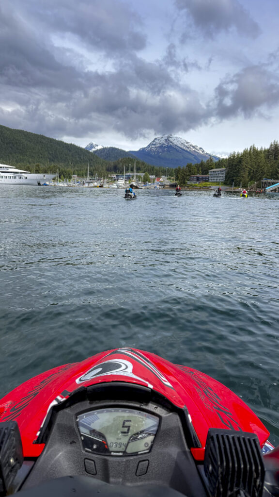 Couple on a jet ski wilderness tour with dangerous waters adventures in Juneau, Alaska.