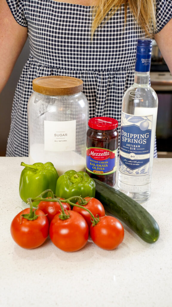 Ingredients on the counter for a Greek Salad Cocktail Clumsies Mediterranean Gimlet Recipe.