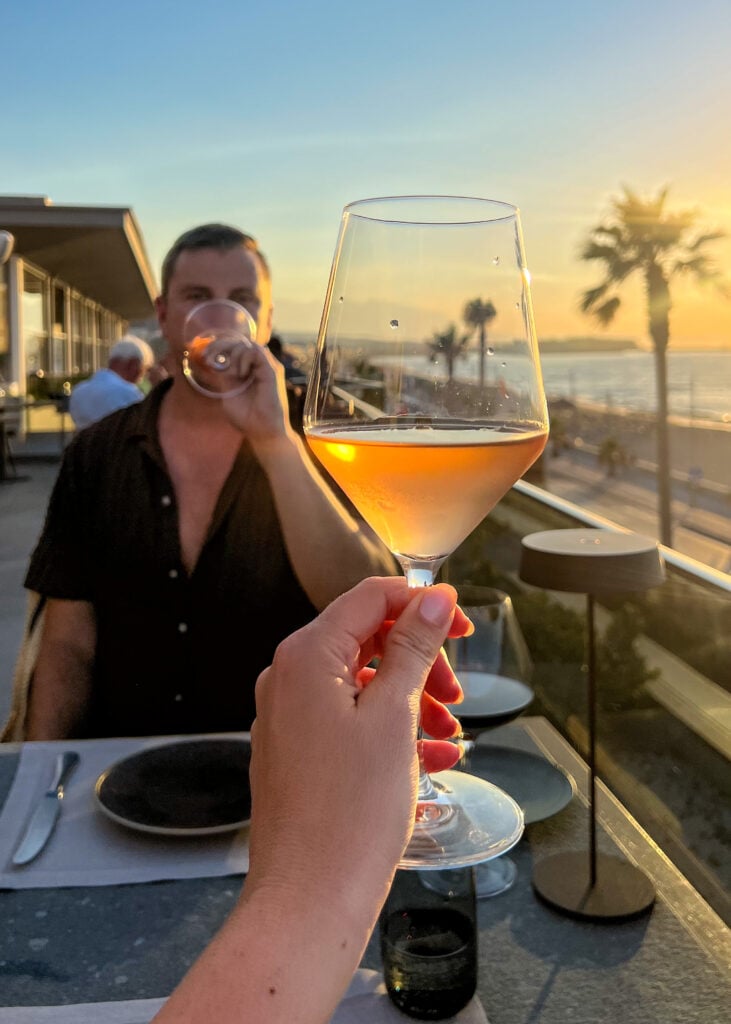 Couple dining at sunset at Aura in Rethymno Crete.