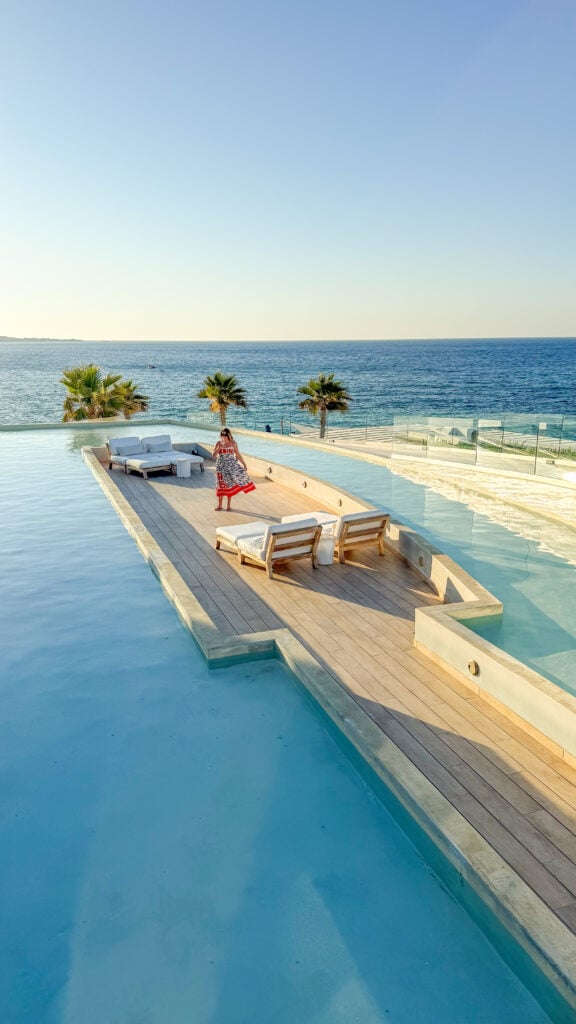 Woman at the pool at Abaton Resort in Crete Greece.