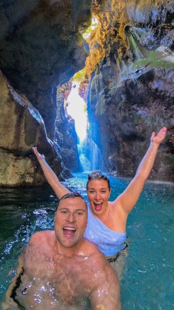 Couple swimming in the hidden waterfall gorge near Rethymno Crete.