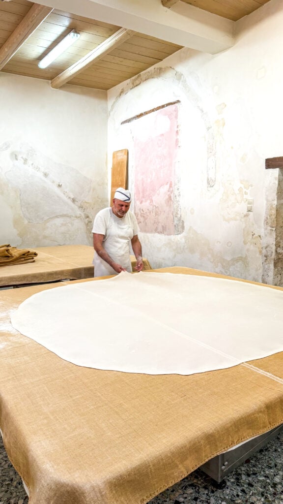 Man leading a phyllo making class in Rethymno Crete