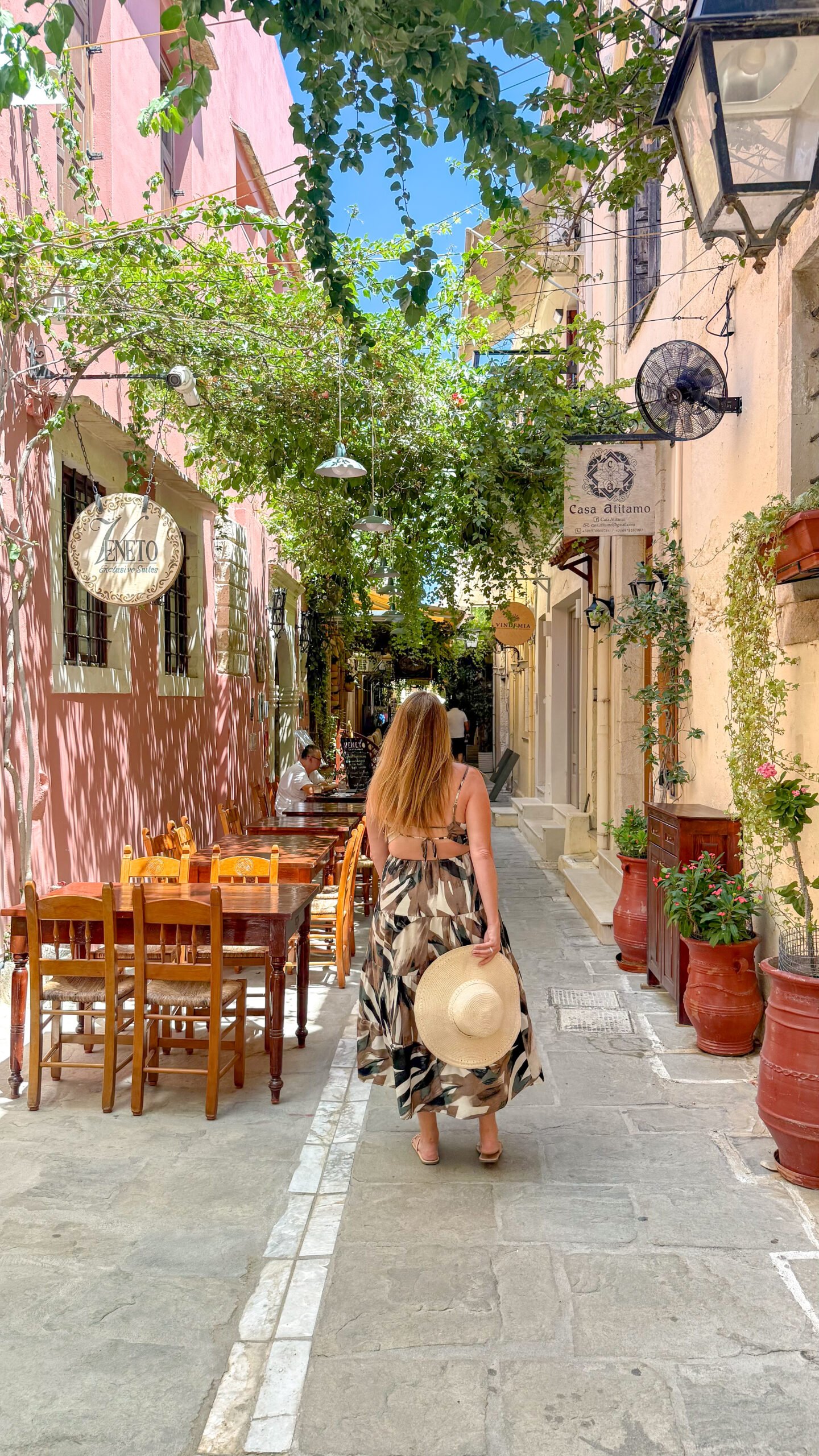 Woman strolling in Old Town Rethymno Crete.