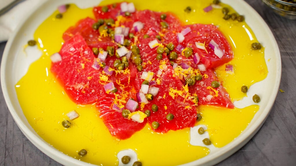 Sicilian sashimi tuna carpaccio recipe on a plate.