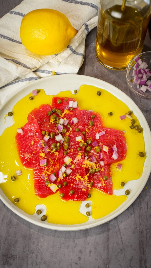 Sicilian sashimi tuna carpaccio recipe on a plate.