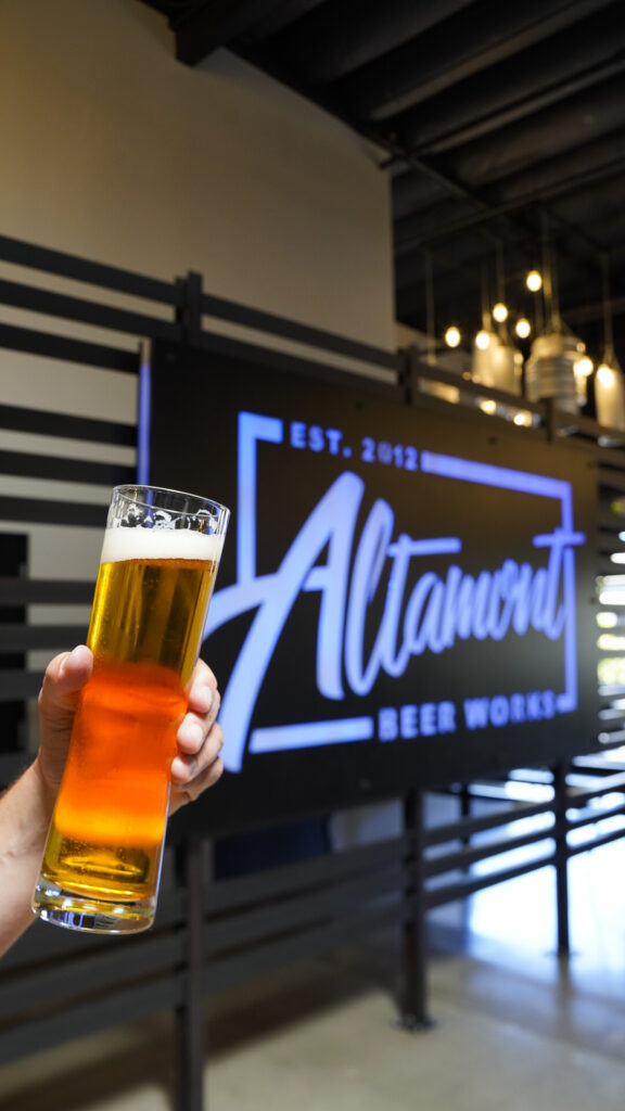 Holding a beer on the TriValley Ale Trail.