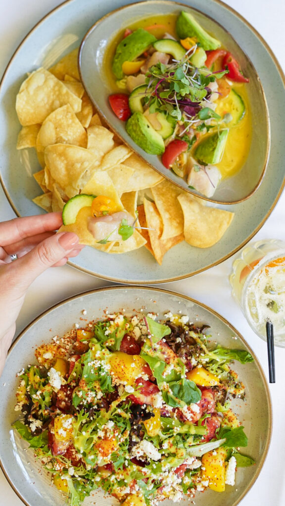 Table with watermelon salad and ceviche.