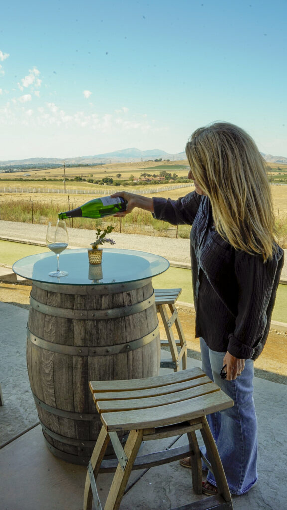 A glass of wine at a wine tasting one of the Top Things to Do in Livermore and Tri-Valley for Couples.