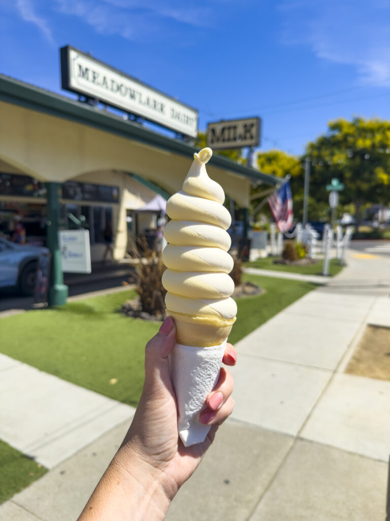 Pineapple ice cream in a cone.