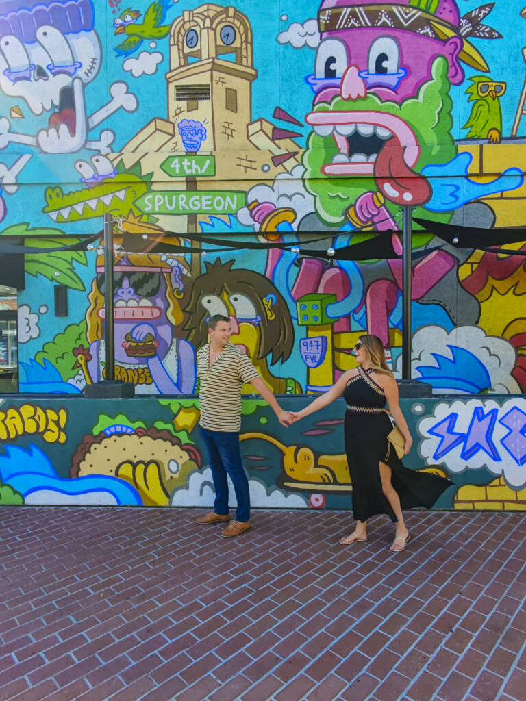 Couple in front of a mural in Santa Ana, California.